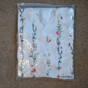 White Top with Floral and Lace Design